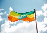 https://www.pexels.com/photo/national-colorful-flag-of-ethiopia-under-cloudy-sky-3794753/